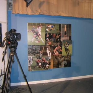 The backdrop for the local high-school's weekly television show's sports desk. Assorted prints mounted to coroplast and attached to a board at differe