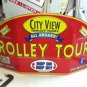 .040 bent aluminum with graphics mounted for a trolley booth sign. i bent the material my hand. sign measures 60" wide by 30" high.
