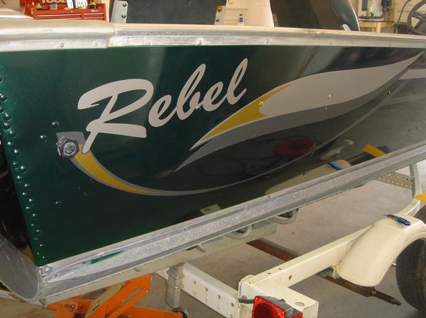 New striping and graphics on a repainted Lund Rebel fishing boat